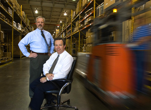 Executives in furniture warehouse