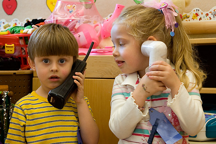 elementary school chilcren playing phone
