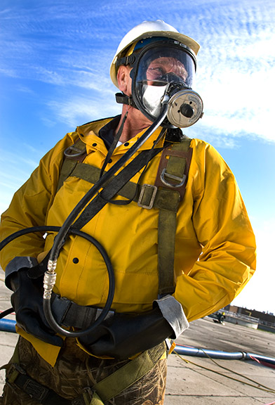 man in respirator industrial photography