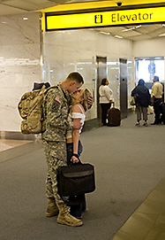 Iraq war soldier kisses girlfriend goodby in airport